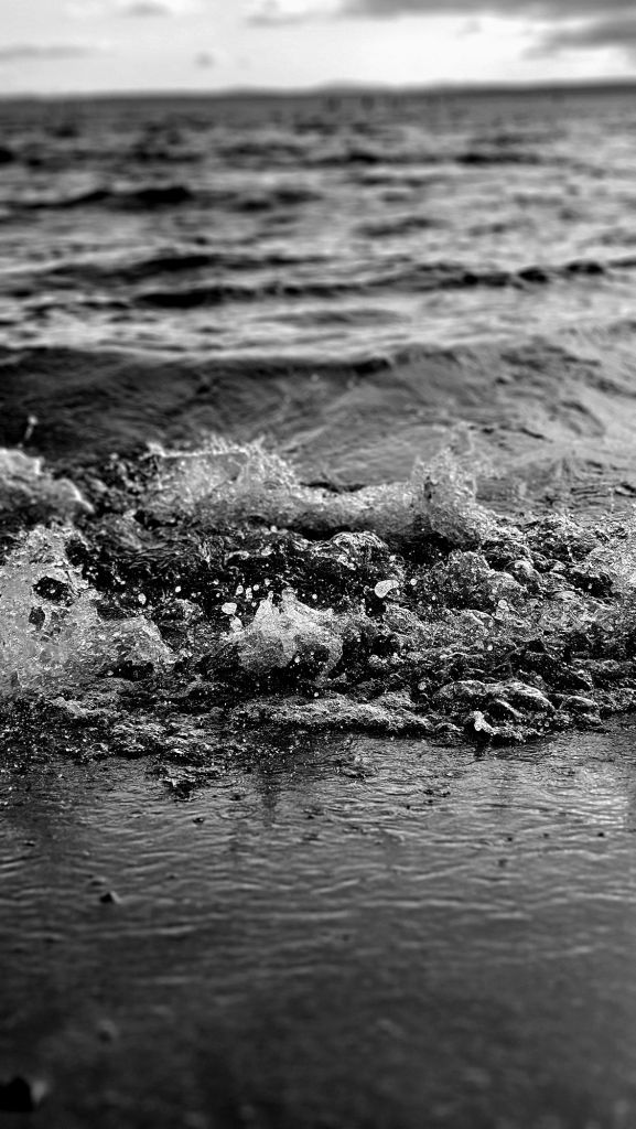 Up Close Black And White Photo Of Waves Crashing