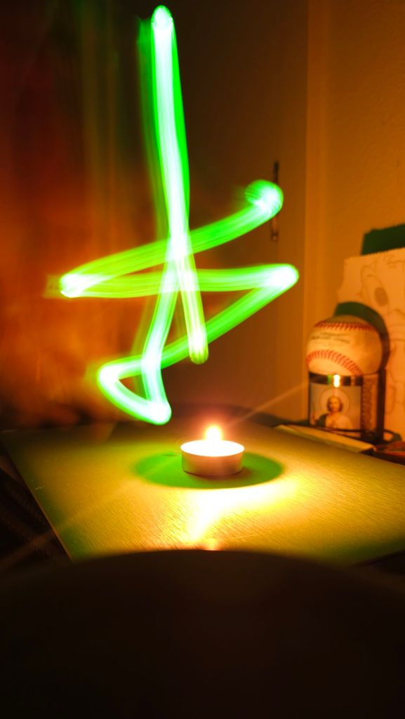 Green Light Painting With A Still Candle